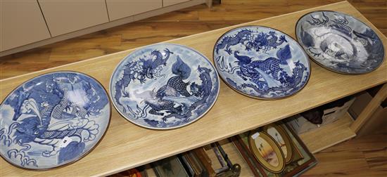 Four Chinese blue and white mythical beast dishes diam 46cm